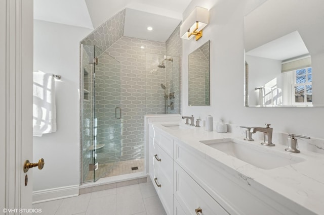 bathroom featuring vanity, tile patterned flooring, and a shower with door