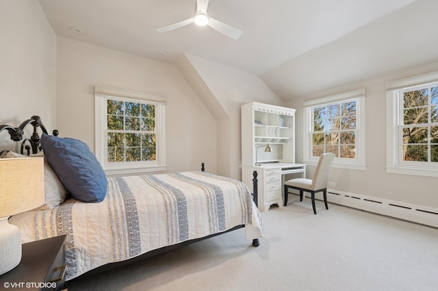 carpeted bedroom with a baseboard heating unit, ceiling fan, and lofted ceiling