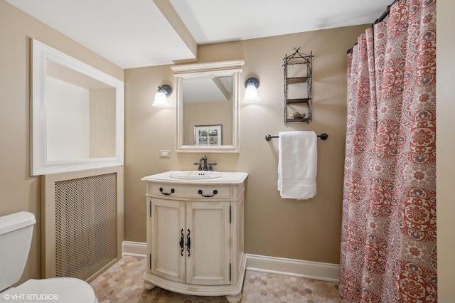 bathroom featuring toilet and vanity