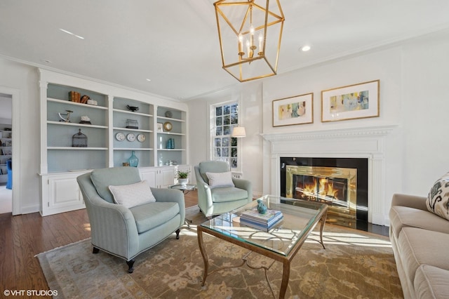 living area with dark wood-type flooring, built in shelves, and an inviting chandelier