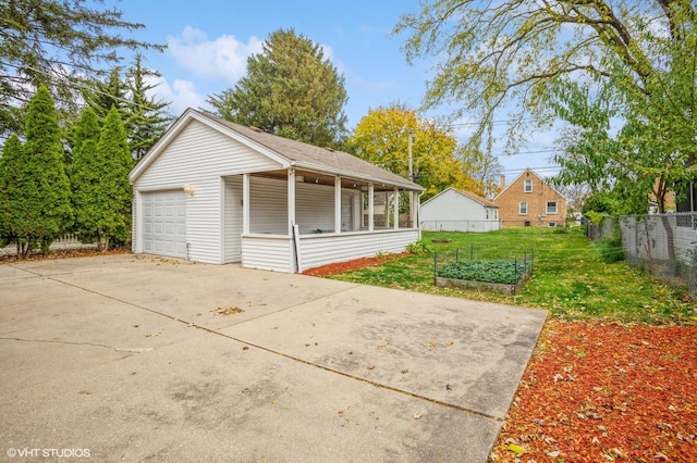 garage with a lawn