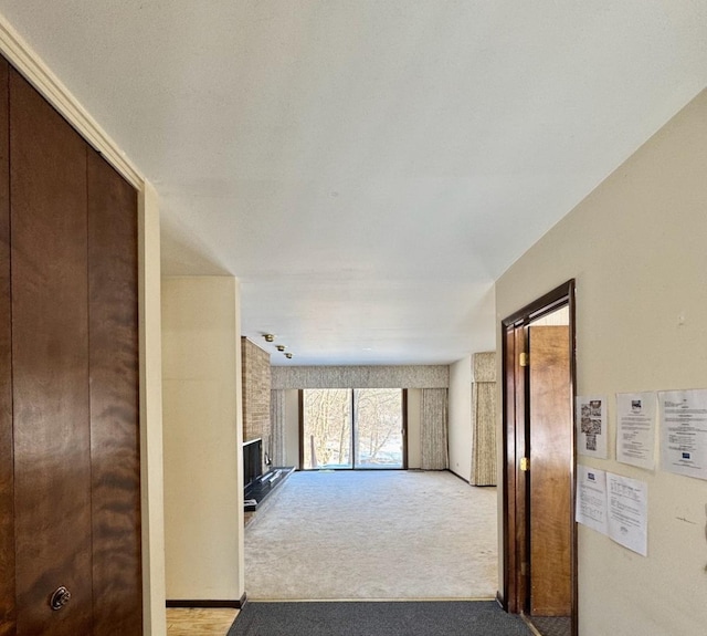 hallway featuring light carpet