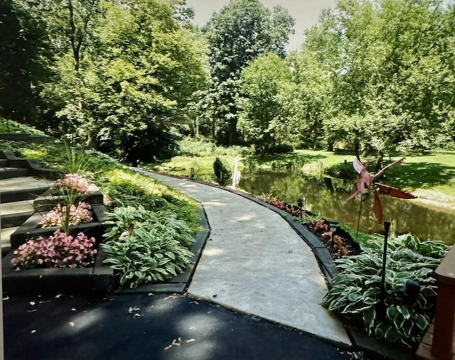 surrounding community featuring a water view