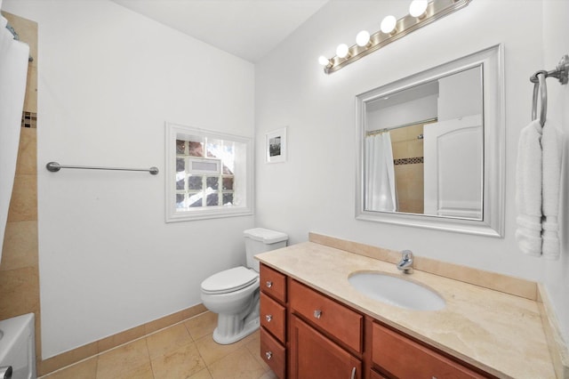 bathroom with toilet, vanity, and tile patterned flooring