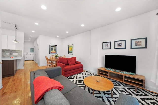 living room with light hardwood / wood-style flooring