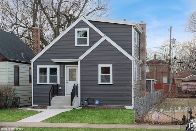 view of front of home with a front lawn