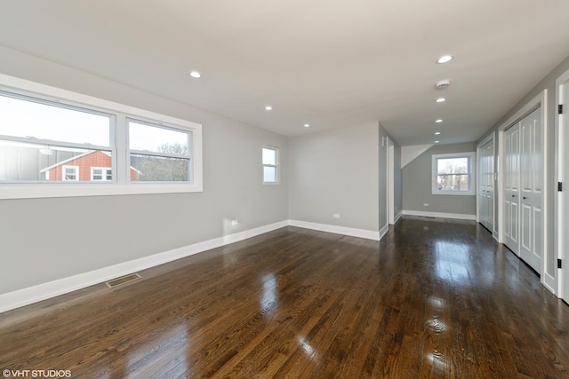 empty room featuring dark hardwood / wood-style flooring