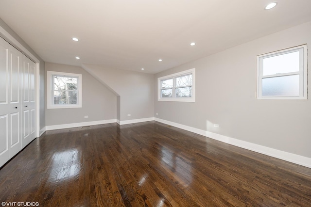 bonus room featuring dark wood-type flooring