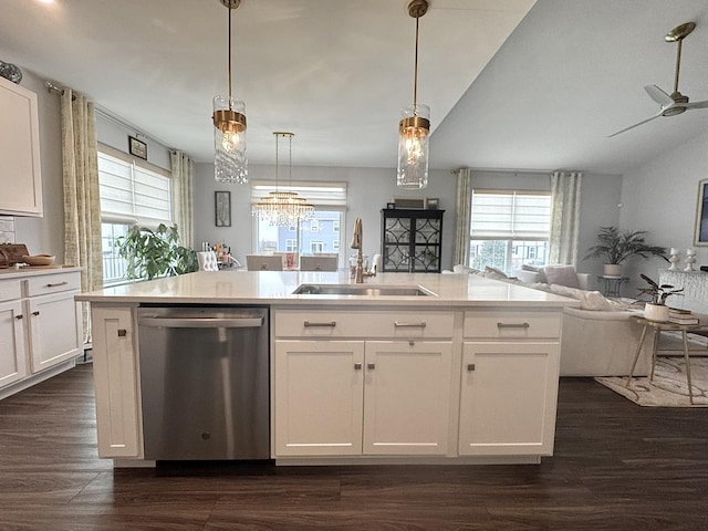 kitchen featuring white cabinetry, dishwasher, sink, and decorative light fixtures