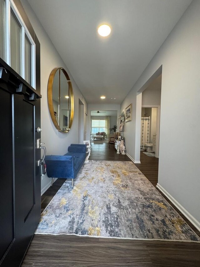 full bathroom featuring hardwood / wood-style flooring, toilet, vanity, and shower / tub combo with curtain