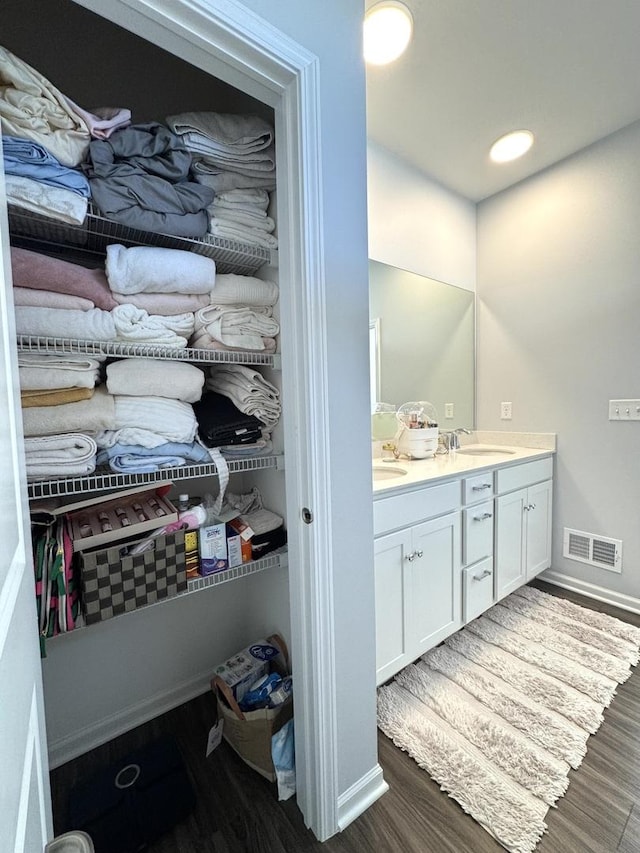 bathroom with vanity and hardwood / wood-style floors