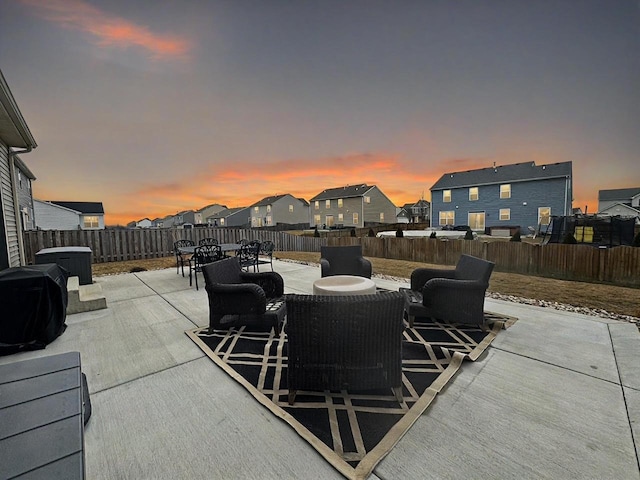 view of patio terrace at dusk