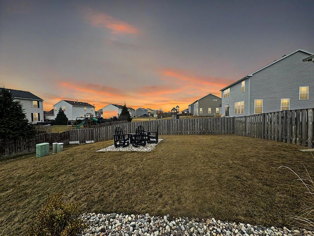 view of yard at dusk