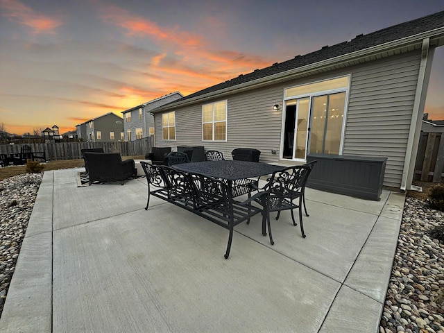 view of patio terrace at dusk