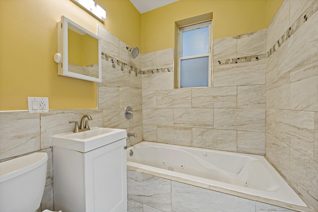 full bathroom with toilet, vanity, and tiled shower / bath combo