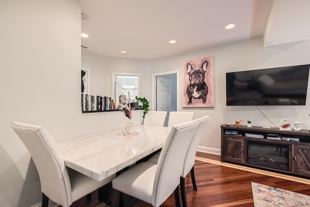 dining space featuring dark wood-type flooring