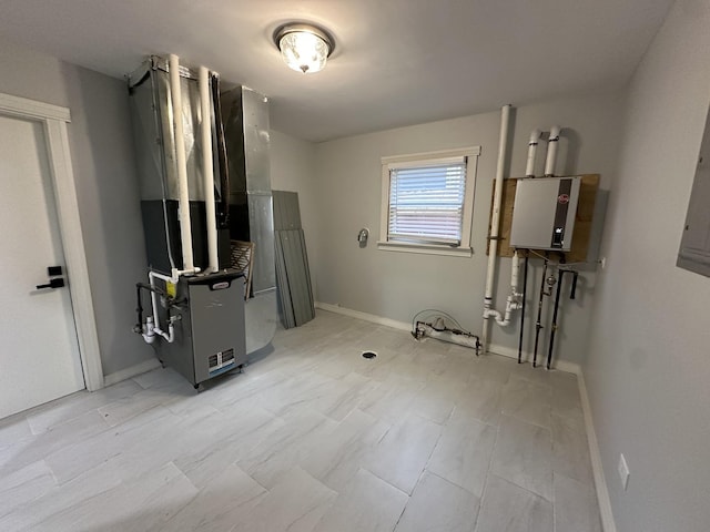 utility room featuring water heater and heating unit