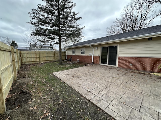 view of yard with a patio and a fenced backyard