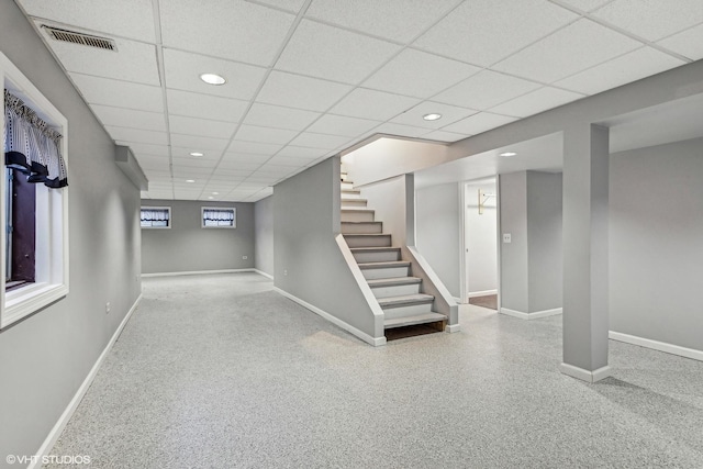 basement featuring a drop ceiling