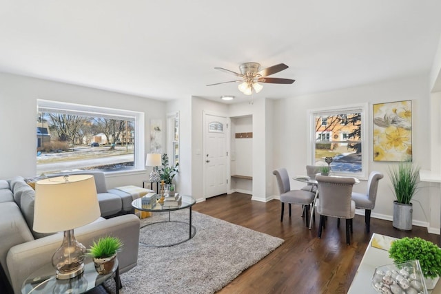 living room with ceiling fan and dark hardwood / wood-style floors