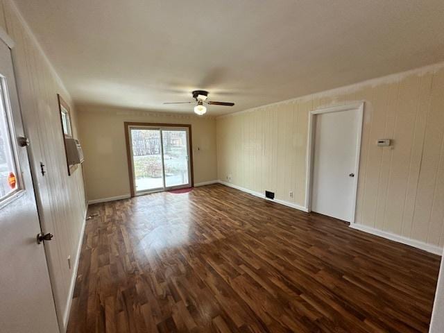 unfurnished room with dark hardwood / wood-style flooring and ceiling fan