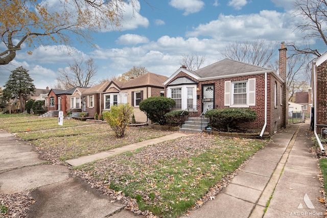 single story home featuring a front yard