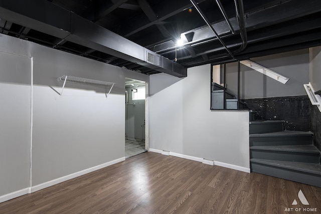 basement featuring dark hardwood / wood-style floors