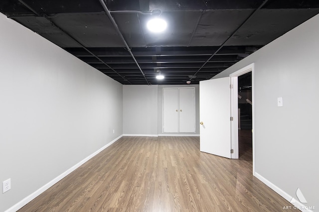 basement featuring wood-type flooring