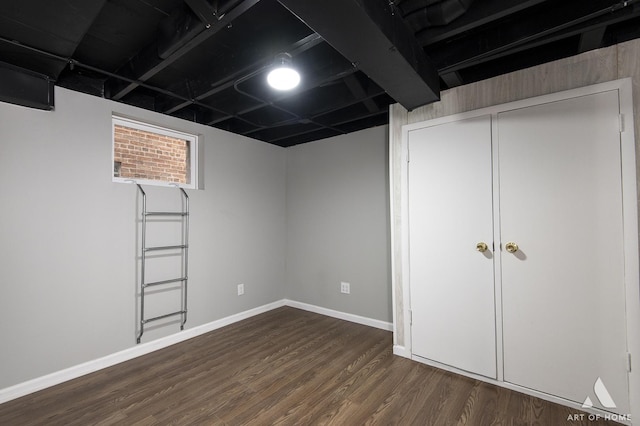 basement with dark wood-type flooring