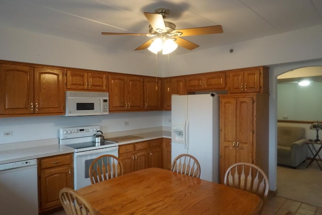 kitchen with white appliances and ceiling fan