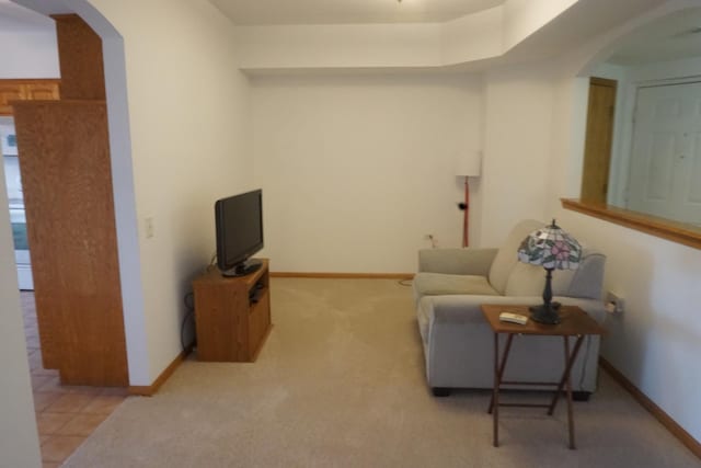 living area with light tile patterned floors