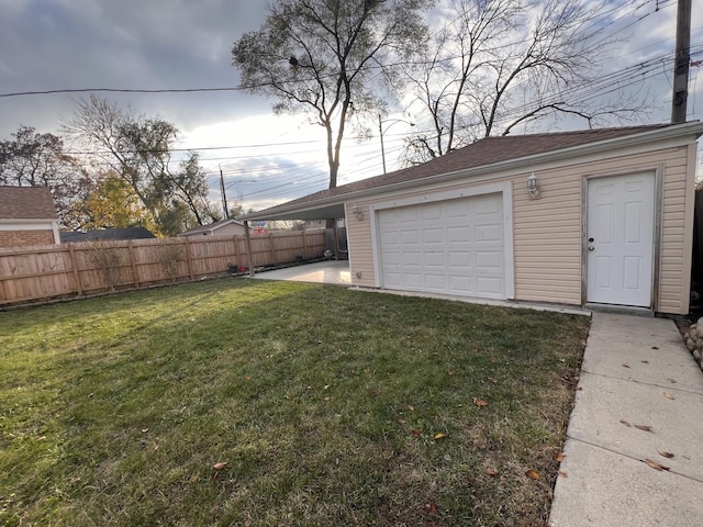 garage featuring a lawn