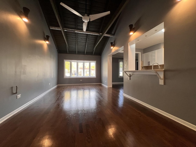 unfurnished room featuring ceiling fan, dark hardwood / wood-style floors, and lofted ceiling