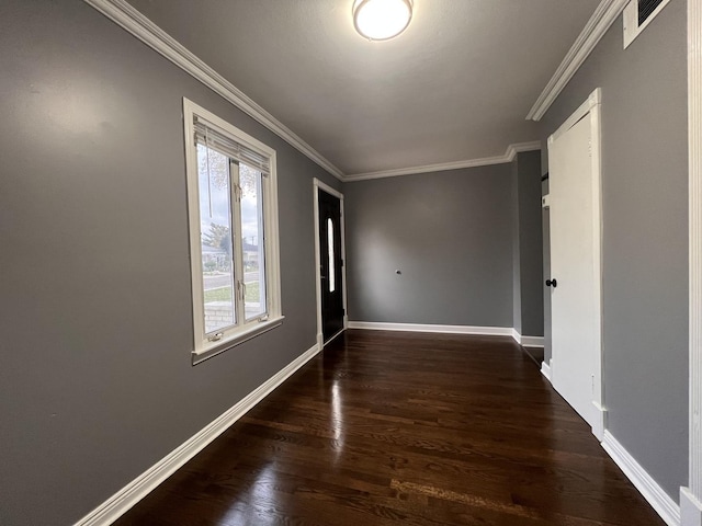 hall with dark hardwood / wood-style flooring and ornamental molding