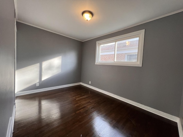 unfurnished room with dark hardwood / wood-style flooring and crown molding