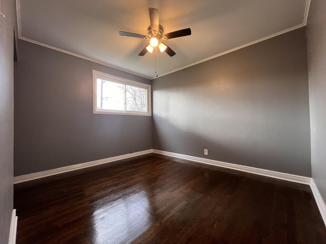 unfurnished room featuring ceiling fan, dark hardwood / wood-style floors, and ornamental molding