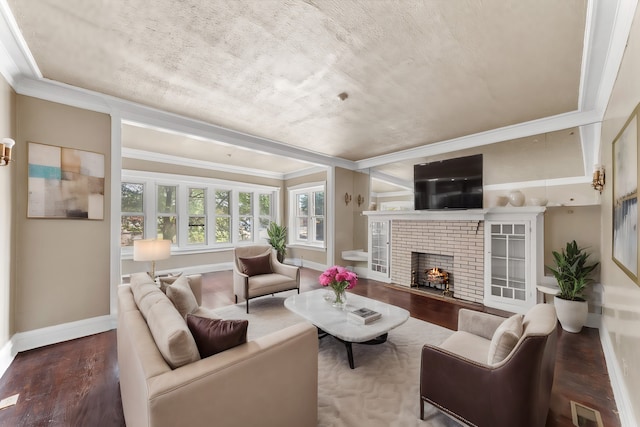 living room with ornamental molding, a fireplace, and wood-type flooring