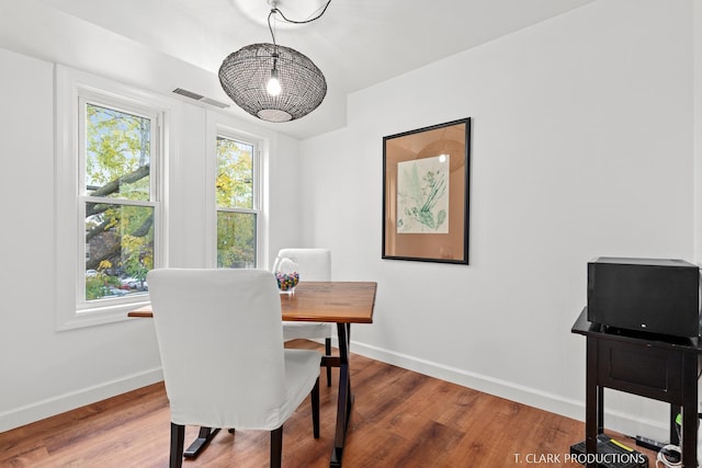 dining room with hardwood / wood-style flooring