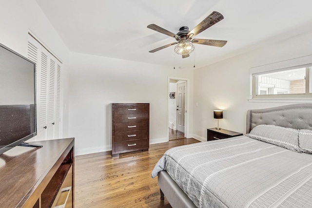 bedroom featuring a closet, ceiling fan, and light wood-type flooring