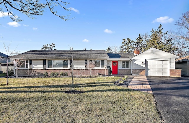 ranch-style house featuring a front yard and a garage