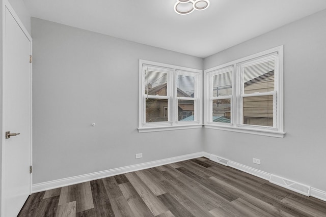 spare room featuring hardwood / wood-style floors