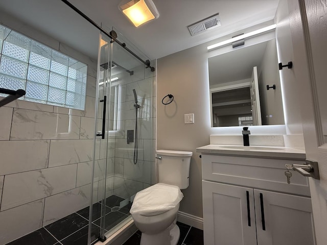 bathroom with toilet, tile patterned floors, walk in shower, and vanity