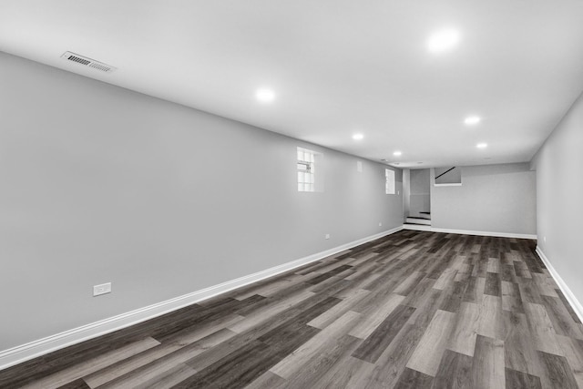 basement featuring dark hardwood / wood-style flooring