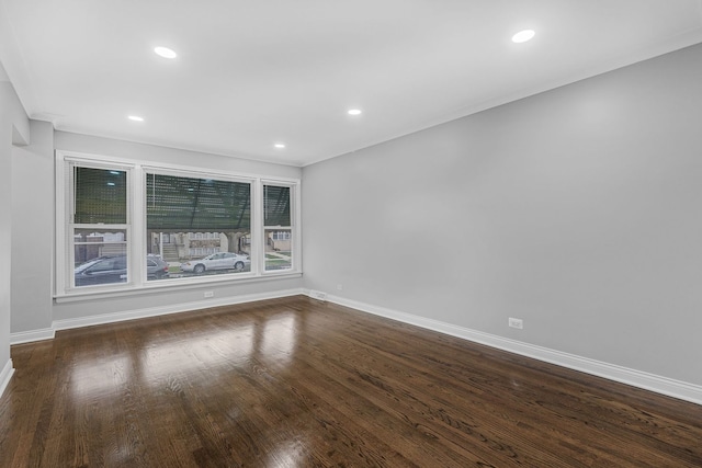 spare room featuring dark wood-type flooring