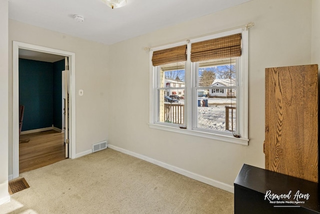 unfurnished bedroom with light colored carpet