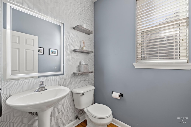 bathroom featuring sink and toilet