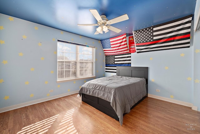 bedroom featuring ceiling fan and wood-type flooring