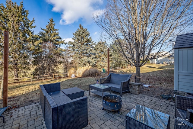 view of patio / terrace featuring an outdoor living space with a fire pit