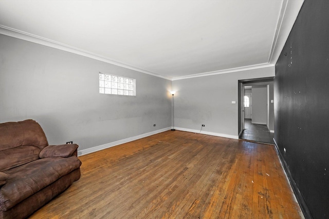 living room featuring plenty of natural light, dark wood-type flooring, and crown molding