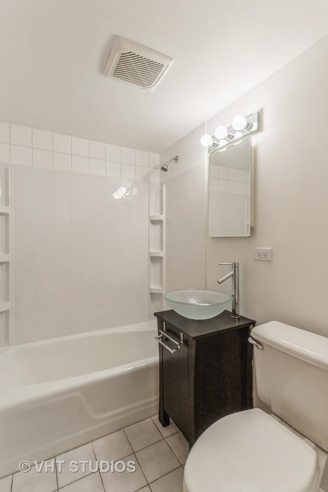 full bathroom featuring toilet, tile patterned floors, tub / shower combination, and vanity